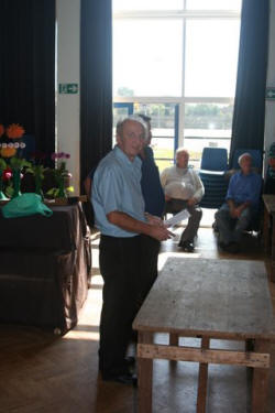 The Chairman has a point of view. Ron looking perplexed at an empty table!